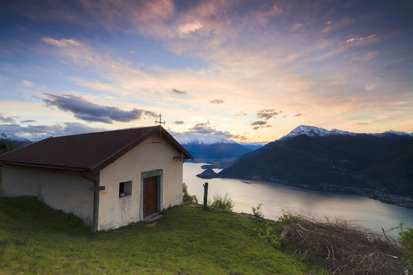 Pink sky at dawn on Lake Como seen from the church of San Domenico Cremia Lombardy Italy Europe