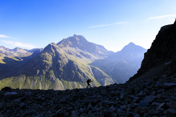 Hiker on the trail to Lej Lagrev, St. Moritz, Engadine, canton of Graubünden, Switzerland, Europe