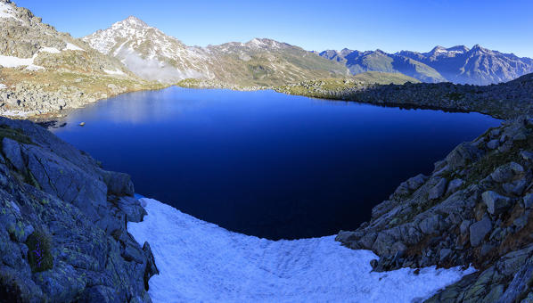 Panoramic of Lake Bergsee at dawn, Spluga Valley, Spluga Pass, province of Sondrio, Lombardy, Valtellina, Italy