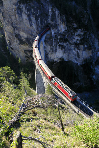 Elevated view of Bernina Express train on Landwasser Viadukt, Filisur, Albula Region, canton of Graubünden, Switzerland, Europe
