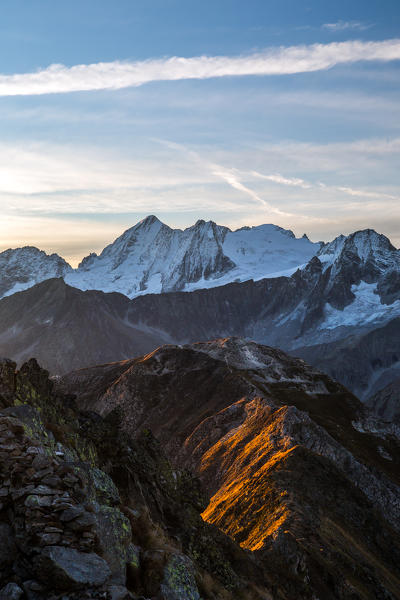 The sunrise lights painting the elegant profiles of the Tonale mount Tonale mount, Lombardy, Italy.Europe