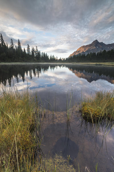Clouds on Lake Entova at dawn, Entova Alp, Malenco Valley, Sondrio province, Valtellina, Lombardy, Italy