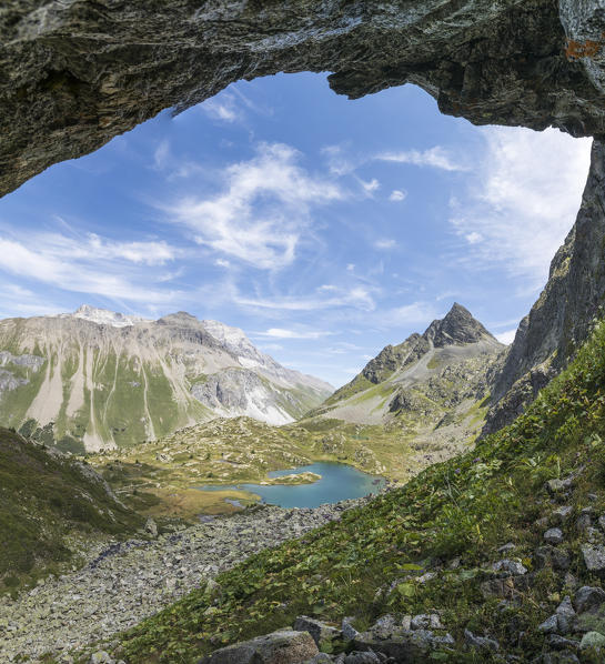 Panoramic of turquoise lake and rocky peaks, Crap Alv Lejets, Albula Pass, canton of Graubünden, Switzerland