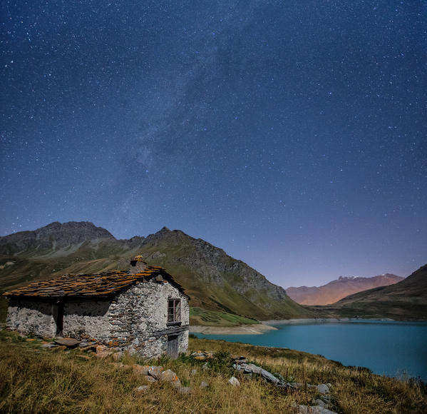 Panoramic shot showing the Milky Way over Lake Moncenisio - Alps, France. Europe