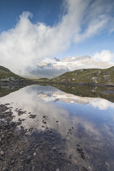 Peaks Arlas, Cambrena, Caral reflected in lake, Bernina Pass, Poschiavo Valley, canton of Graubünden, Engadine, Switzerland