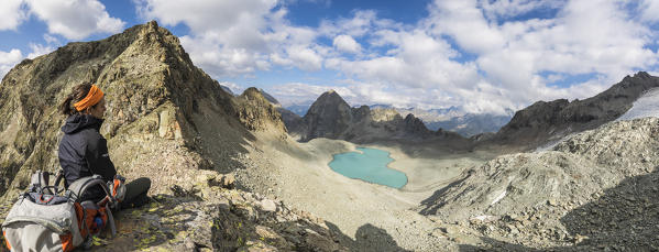 Panoramic of hiker at Lej Lagrev during summer, Silvaplana, canton of Graubünden, Engadine, Switzerland