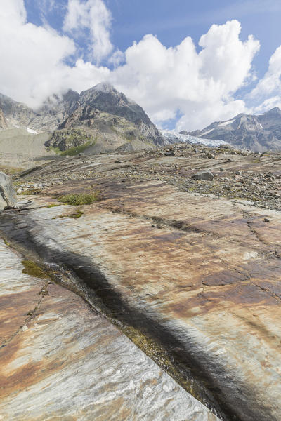 Slabs of rock with Fellaria Glacier in the background, Sentiero Glaciologico, Malenco Valley, Valtellina, Lombardy, Italy