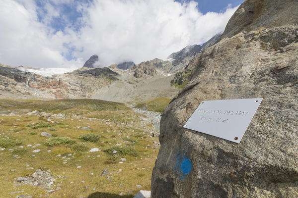 Plaque on rocks, Sentiero Glaciologico of Fellaria Glacier, Malenco Valley, Valtellina, Lombardy, Italy