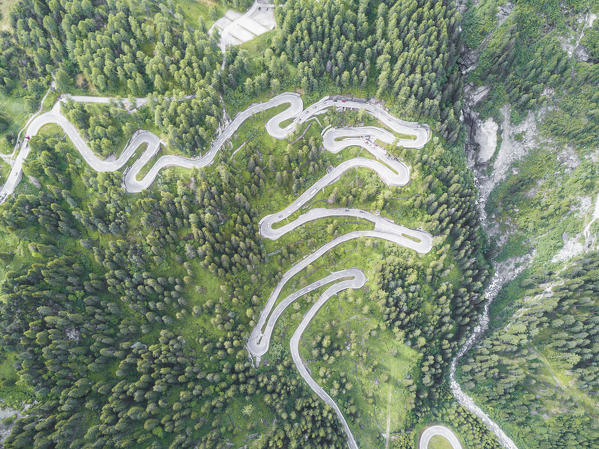 Aerial view of curves of the road between woods, Maloja Pass, Bregaglia Valley, canton of Graubünden, Engadine, Switzerland