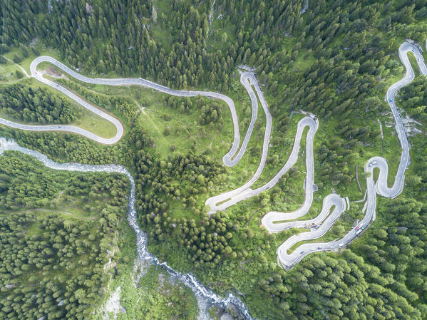 Aerial view of curves of the road between woods, Maloja Pass, Bregaglia Valley, canton of Graubünden, Engadine, Switzerland