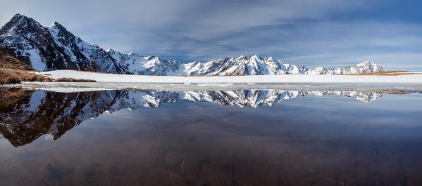 The peaks of Val Lesina are reflected in the small lake Alpe Piazza Orobie alps, Valtellina, Sondrio, Lombardy, Italy Europe