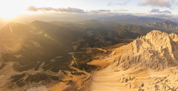 Panoramic aerial view of Latemar massif and Obereggen at sunset, Dolomites, South Tyrol, Italy