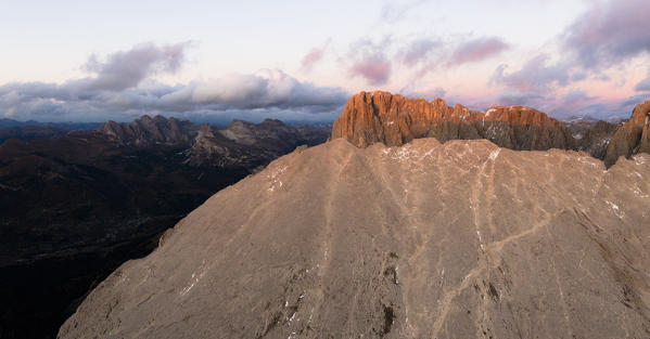 Aerial view of Sassolungo and Sassopiatto mountain range at sunset, Dolomites, South Tyrol, Italy