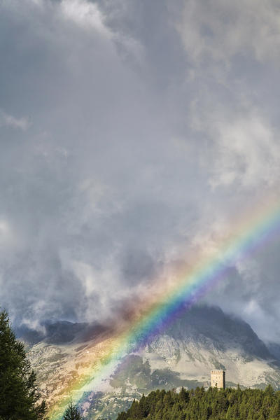 Rainbow and clouds over Tower Belvedere, Maloja Pass, Bregaglia Valley, Canton of Graubunden, Engadin, Switzerland