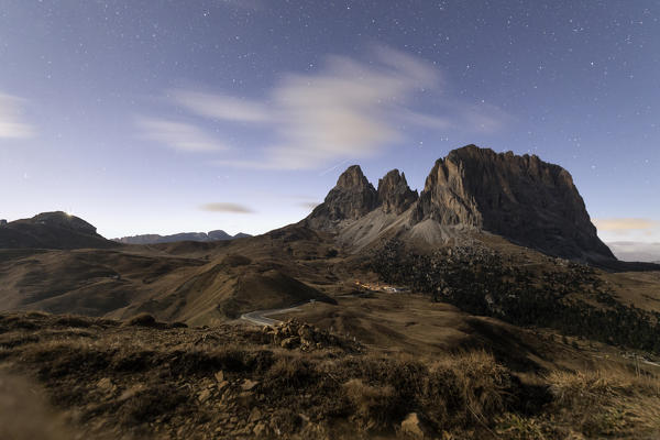 Starry sky on rocky peaks of Sassolungo, Sella Pass, Dolomites, South Tyrol, Bolzano province, Italy