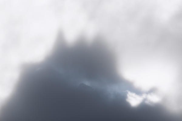 Foggy sky above Cime Del Largo, Bregaglia Valley, canton of Graubunden, Switzerland