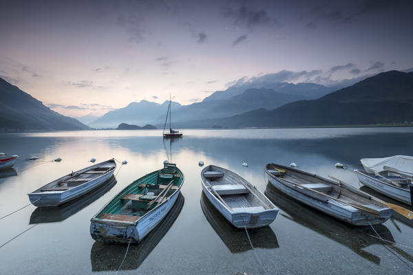 Boats moored in Lake Sils at sunrise, Plaun da Lej, canton of Graubunden, Engadine. Switzerland