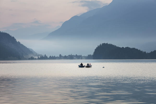 Fishermen's boats at sunrise, Lake Sils, Plaun da Lej, canton of Graubunden, Engadine. Switzerland
