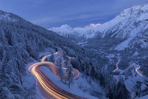 Car lights on the hairpin bends at night, Maloja Pass, Engadin, canton of Graubunden, Switzerland
