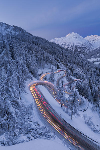 Car lights on the hairpin bends at night, Maloja Pass, Engadin, canton of Graubunden, Switzerland