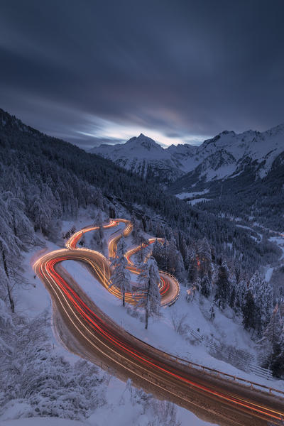 Car lights on the hairpin bends at night, Maloja Pass, Engadin, canton of Graubunden, Switzerland