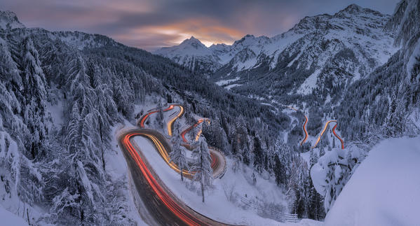 Panoramic of car lights at night, Maloja Pass, Engadin, canton of Graubunden, Switzerland