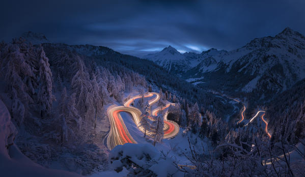 Panoramic of car lights at night, Maloja Pass, Engadin, canton of Graubunden, Switzerland