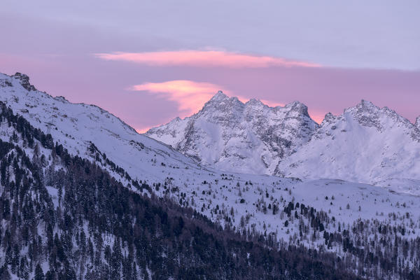 Sunrise on the snowy peak of Piz Da La Margna, St.Moritz, canton of Graubunden Engadin, Switzerland