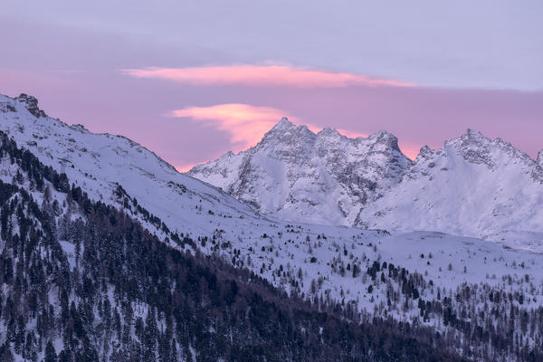 Sunrise on the snowy peak of Piz Da La Margna, St.Moritz, canton of Graubunden Engadin, Switzerland