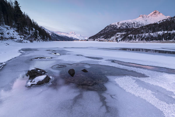 Piz Julier and Piz Da La Margna seen from frozen Lake Champfer, Silvaplana, canton of Graubunden, Engadin, Switzerland