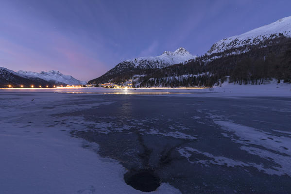 Piz Julier and Piz Da La Margna seen from frozen Lake Champfer at dusk, Silvaplana, canton of Graubunden, Engadin, Switzerland