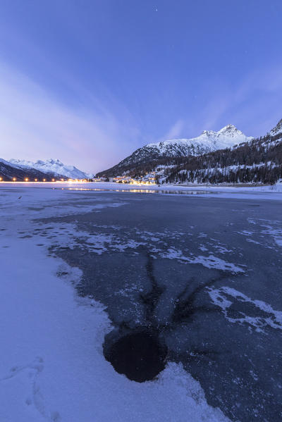 Piz Julier and Piz Da La Margna seen from frozen Lake Champfer at dusk, Silvaplana, canton of Graubunden, Engadin, Switzerland