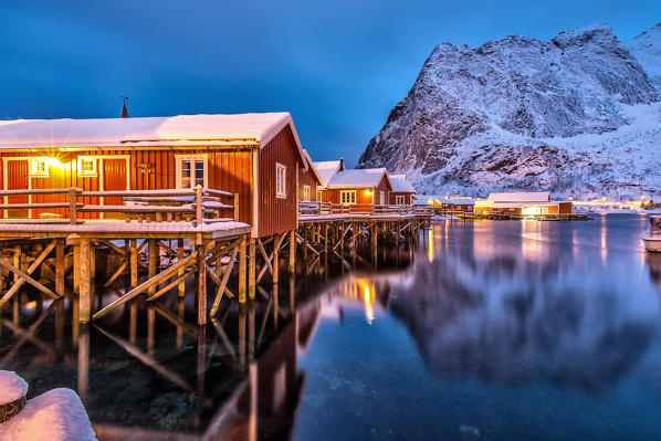 The typical fishermen houses called Rorbu in Reine at dusk. Lofoten islands. Norway. Europe