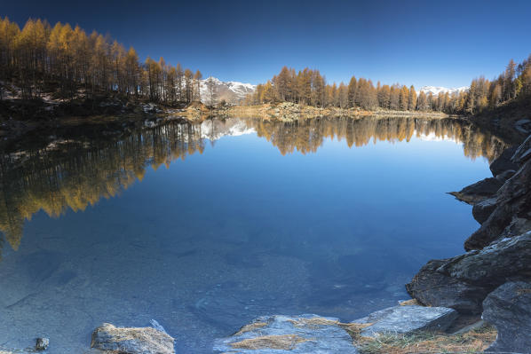 Panoramic of Lago Azzurro during autumn, Spluga Valley, province of Sondrio, Valtellina, Lombardy, Italy