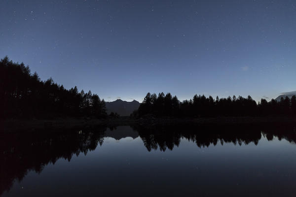 Starry sky on Lago Azzurro, Spluga Valley, province of Sondrio, Valtellina, Lombardy, Italy