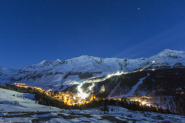 Illuminated ski area of Madesimo, Spluga Valley, province of Sondrio, Valtellina, Lombardy, Italy
