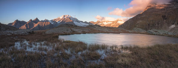 Panoramic of lake and Monte Disgrazia at dawn, Alpe Fora, Malenco Valley, province of Sondrio, Valtellina, Lombardy, Italy