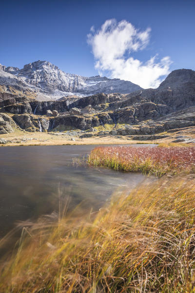 Alpine lake during autumn, Alpe Fora, Malenco Valley, province of Sondrio, Valtellina, Lombardy, Italy