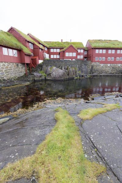 Grass roofs in Tinganes, the old town of Torshavn with red old wooden houses, Streymoy Island, Faroe Islands