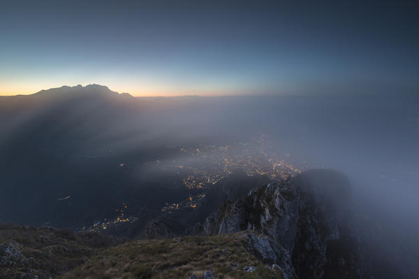 Mist above Lecco at dawn, Monte Coltignone, Lombardy, Italy