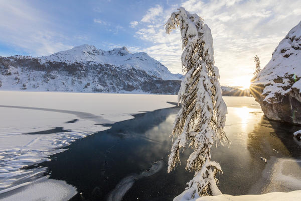Sunset on frozen Lake Sils, Plaun da Lej, Maloja Region, Canton of Graubunden, Engadin, Switzerland