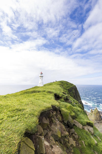 Lighthouse on islet known as Mykines Holmur, Mykines island, Faroe Islands, Denmark