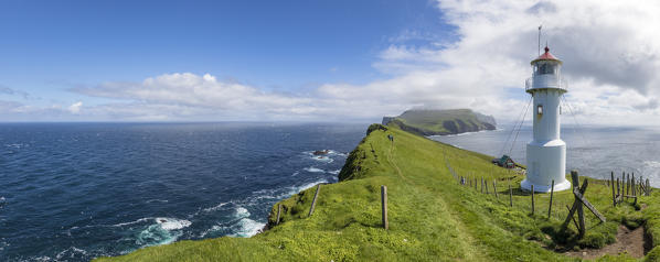 Panoramic of lighthouse on islet known as Mykines Holmur, Mykines island, Faroe Islands, Denmark