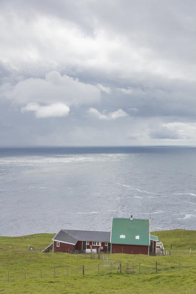 Traditional houses oceanfront, Mykines island, Faroe Islands, Denmark