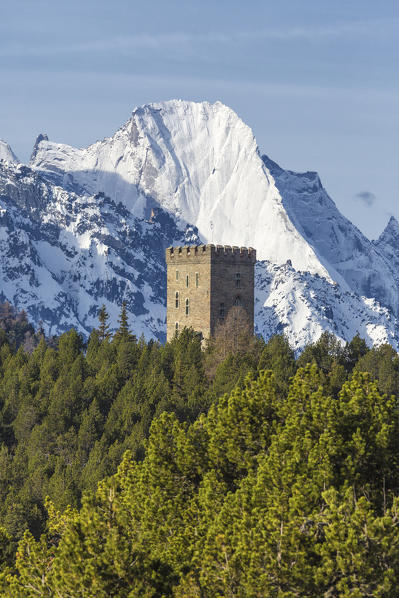 The Belvedere Tower frames the snowy peaks and Peak Badile on a spring day Maloja Pass Canton of Graubunden Switzerland 