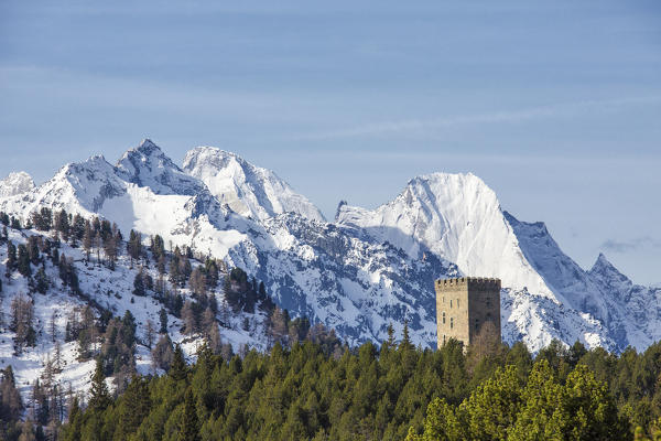 The Belvedere Tower frames the snowy peaks and Peak Badile on a spring day Maloja Pass Canton of Graubunden Switzerland 