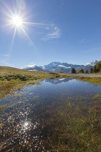 Sunburst on Cima Piazzi, Val Vezzola, Valdidentro, Valtellina, Sondrio province, Lombardy, Italy