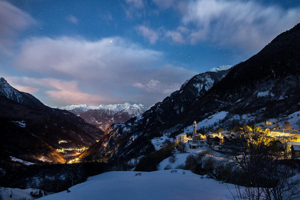 The first lights of sunrise on the village of Soglio. Bregaglia Valley Canton of Graubünden Switzerland Europe