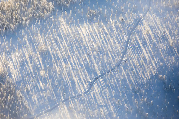 Aerial view of road along the snow covered woods, Levi, Kittila, Lapland, Finland