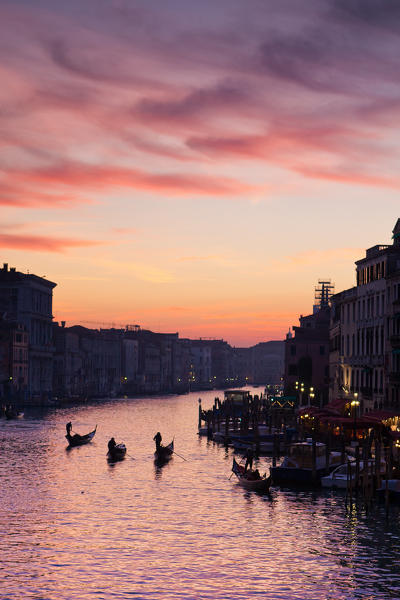 Gondolas along the Grand Canal in Venice at sunset. Veneto Italy Europe